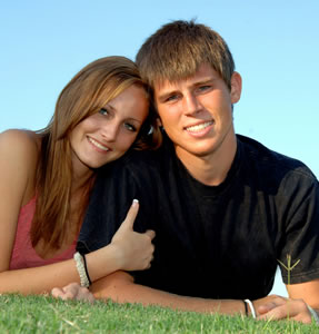 stock photo of boy and girl in field